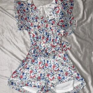 Floral romper, never worn.